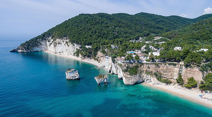 High white cliffs and sea stacks at Baia delle Zagare, Gargano